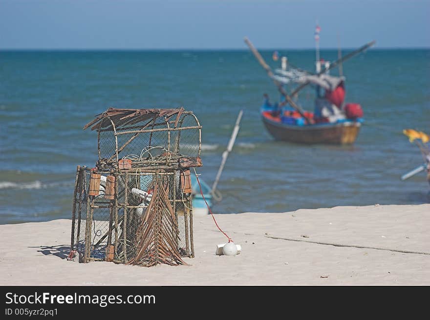 Lobster pot and fishing boat