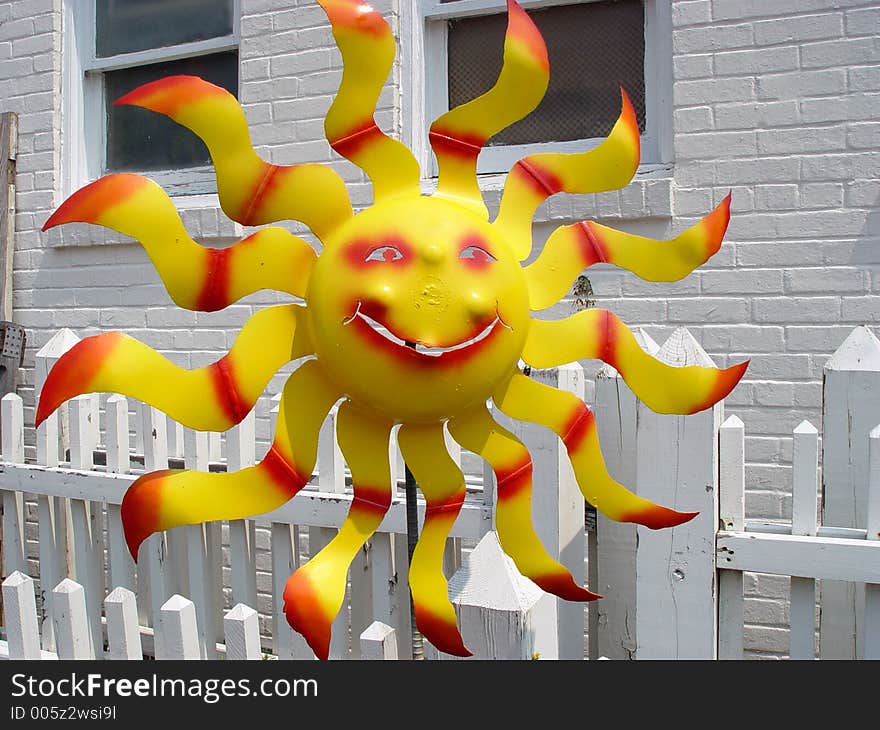 Hand crafted item  made to look like a hot 
smiling sun.