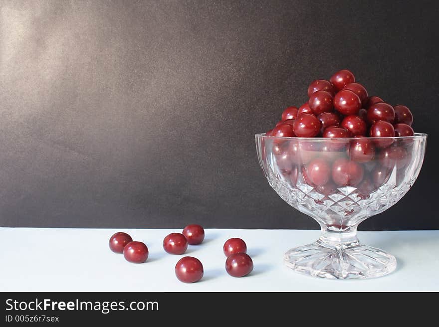 A brown frame with cherries. A brown frame with cherries