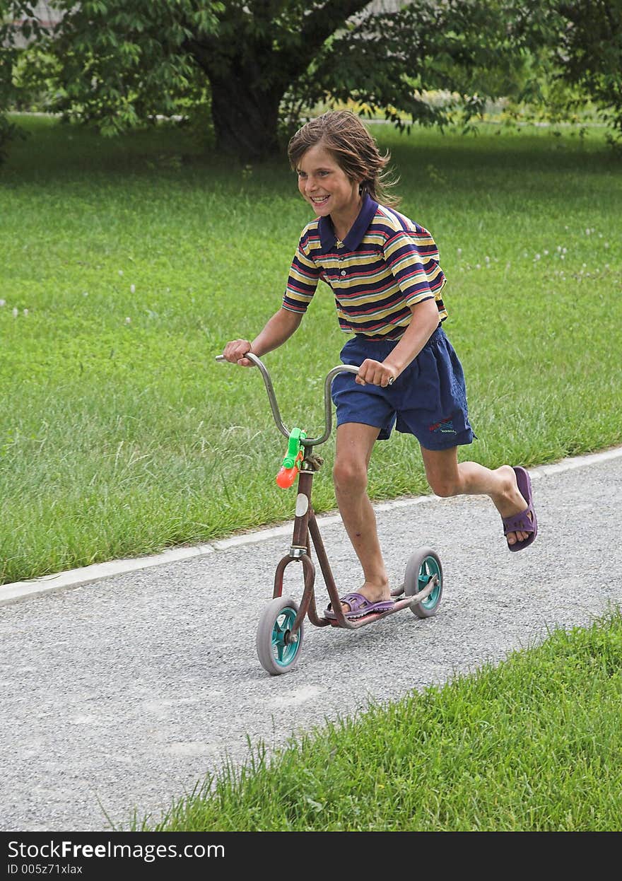 Boy In The Scooter