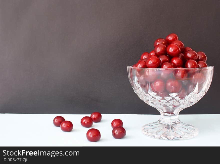 A brown frame with cherries. A brown frame with cherries