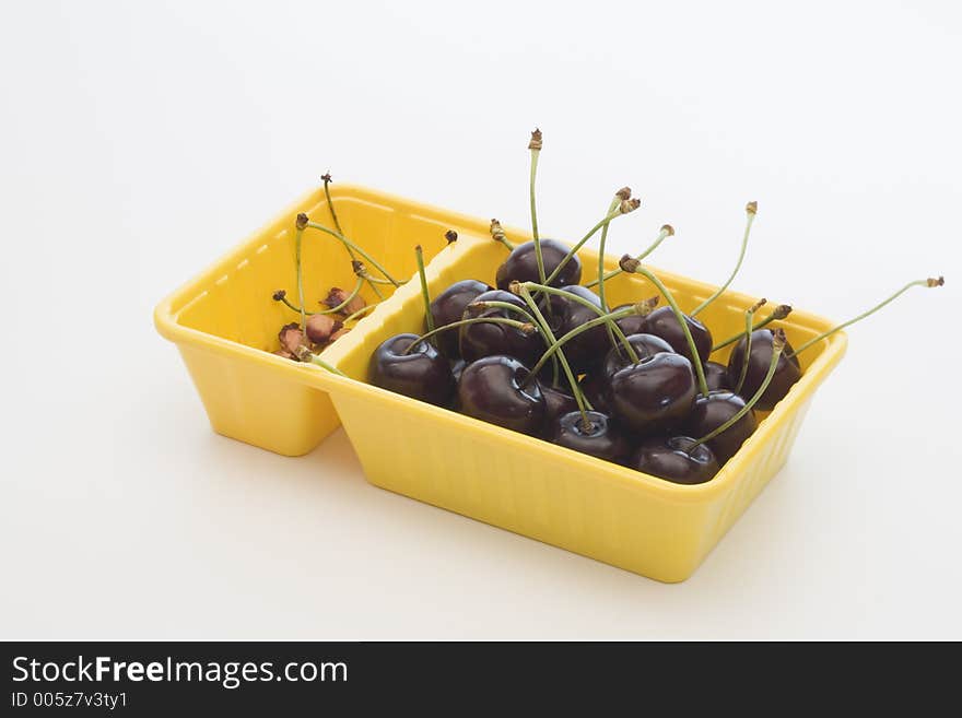 Cherries on a yellow box. Cherries on a yellow box