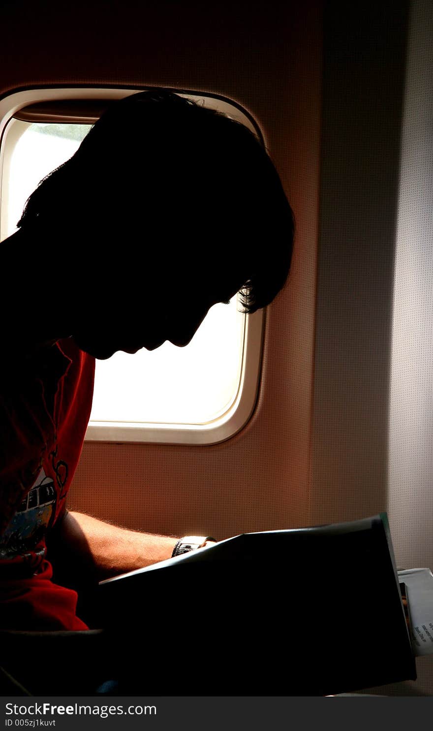 Silhouette Of A Man In The Airplane. Silhouette Of A Man In The Airplane