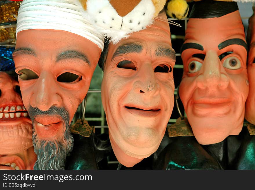 Masks at an alley stall in Hong Kong with really ugly faces. Masks at an alley stall in Hong Kong with really ugly faces