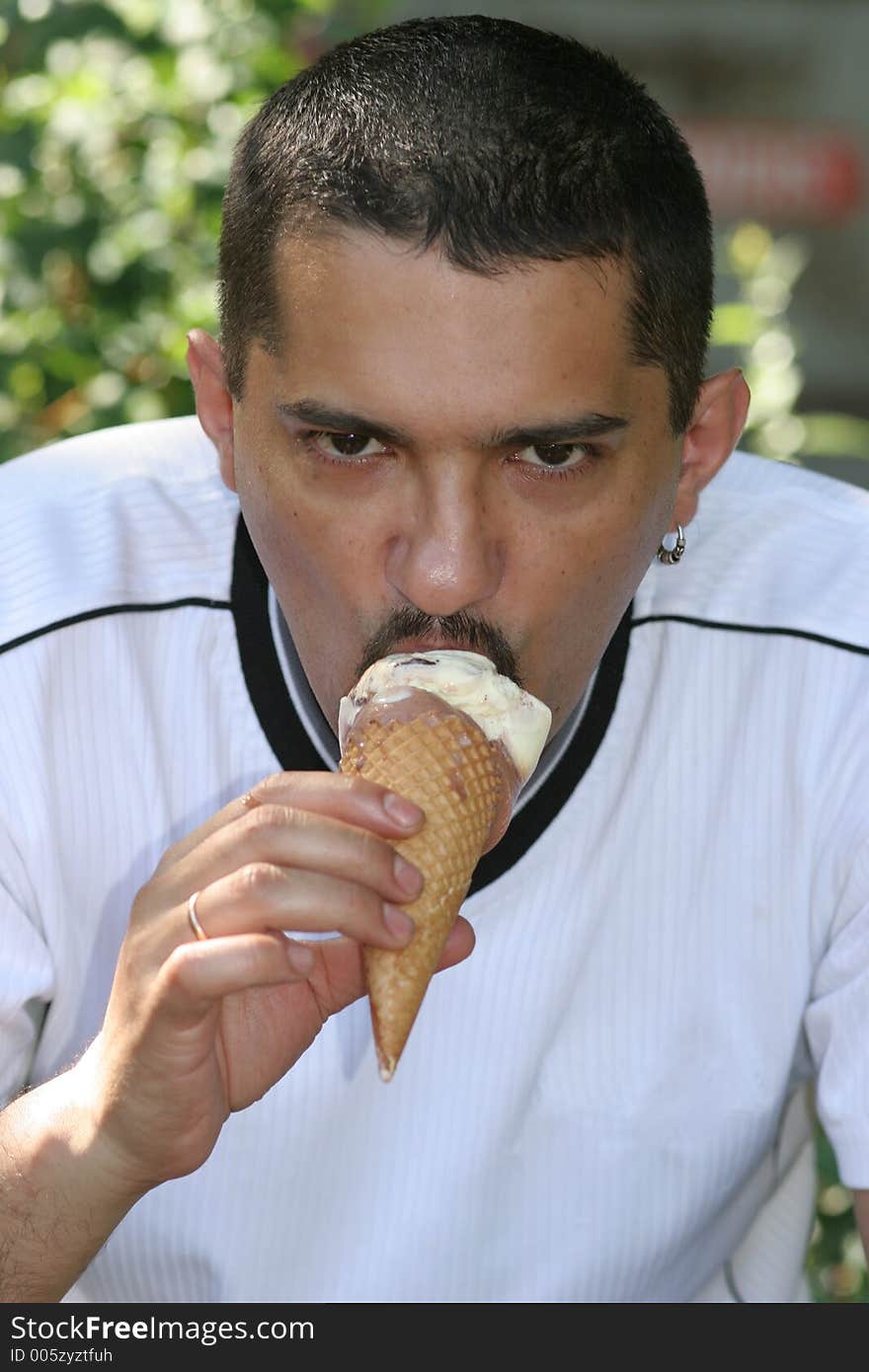 Portrait of a man eating ice cream. Portrait of a man eating ice cream