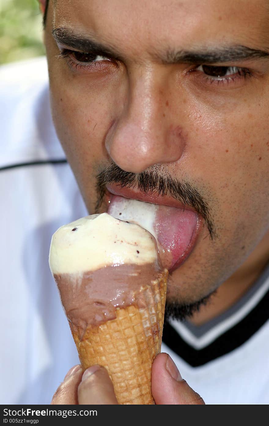 Portrait of a man eating ice cream