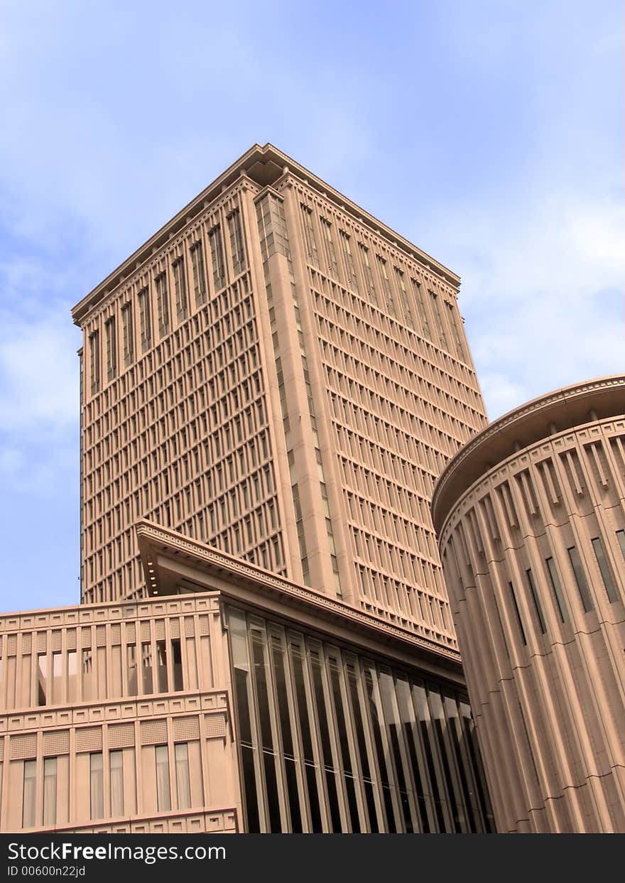 Modern corporate building over cloudy sky