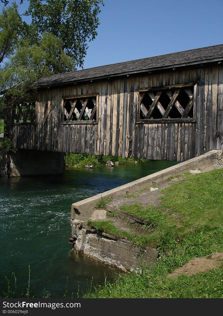 Wooden bridge through the river