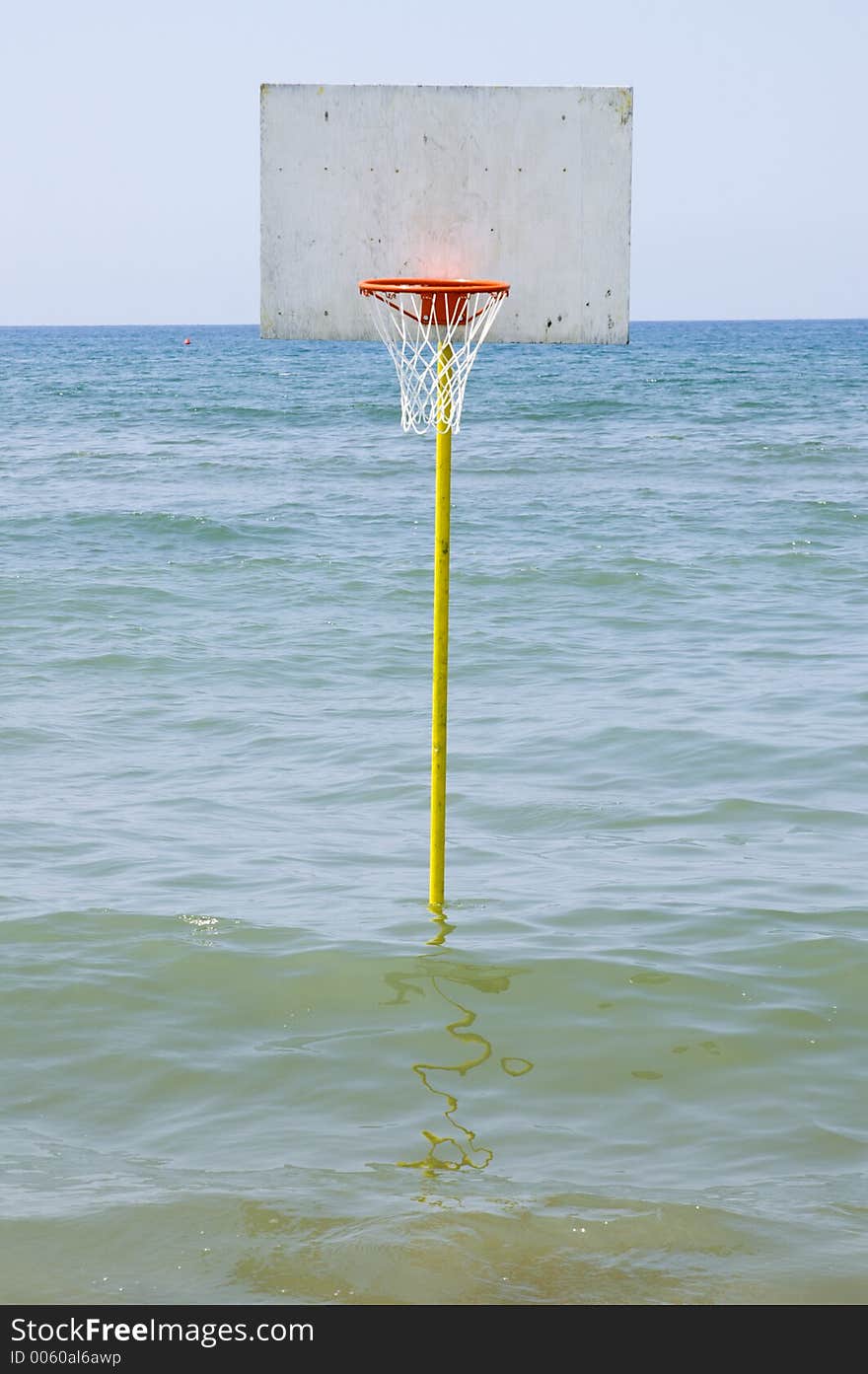 A basket ball in the sea in italy. A basket ball in the sea in italy