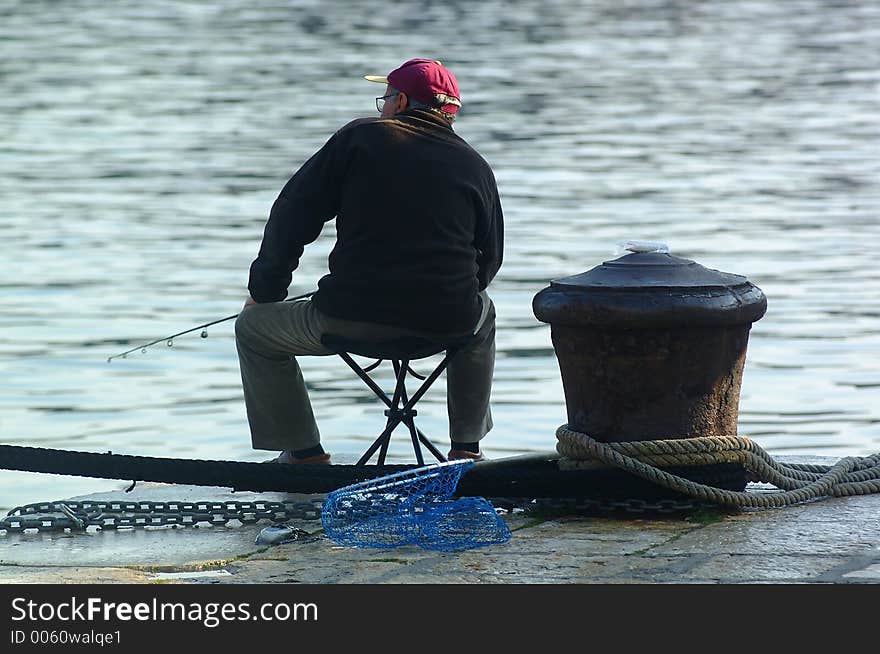 Fisherman fishing in marine