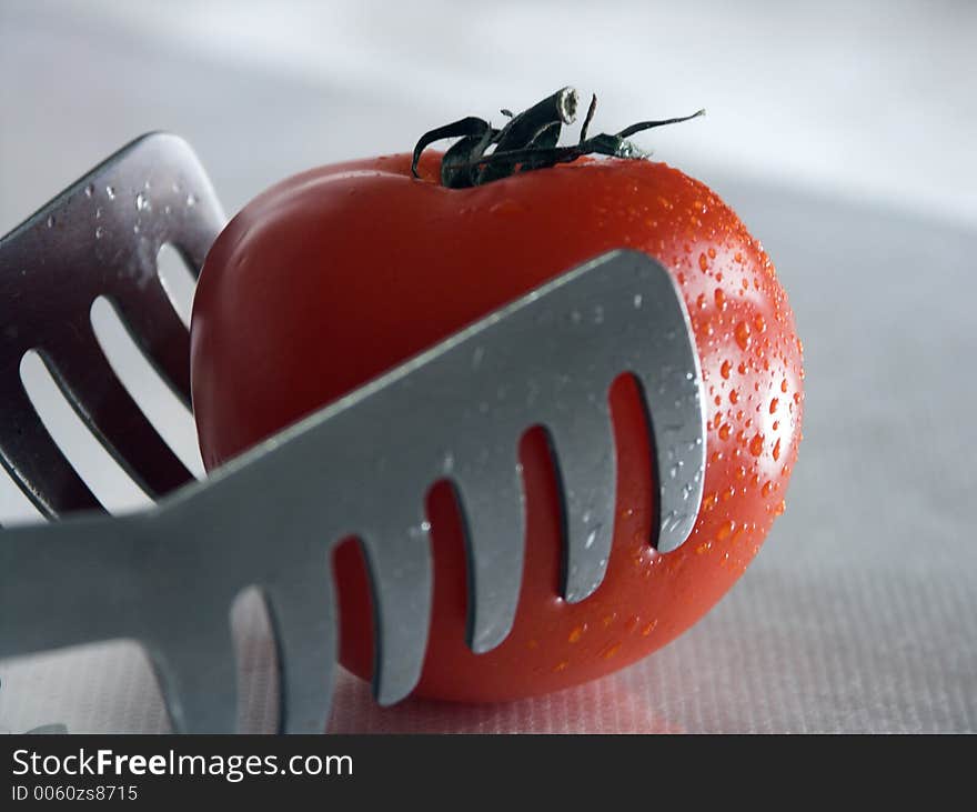 Tomato And Tongs