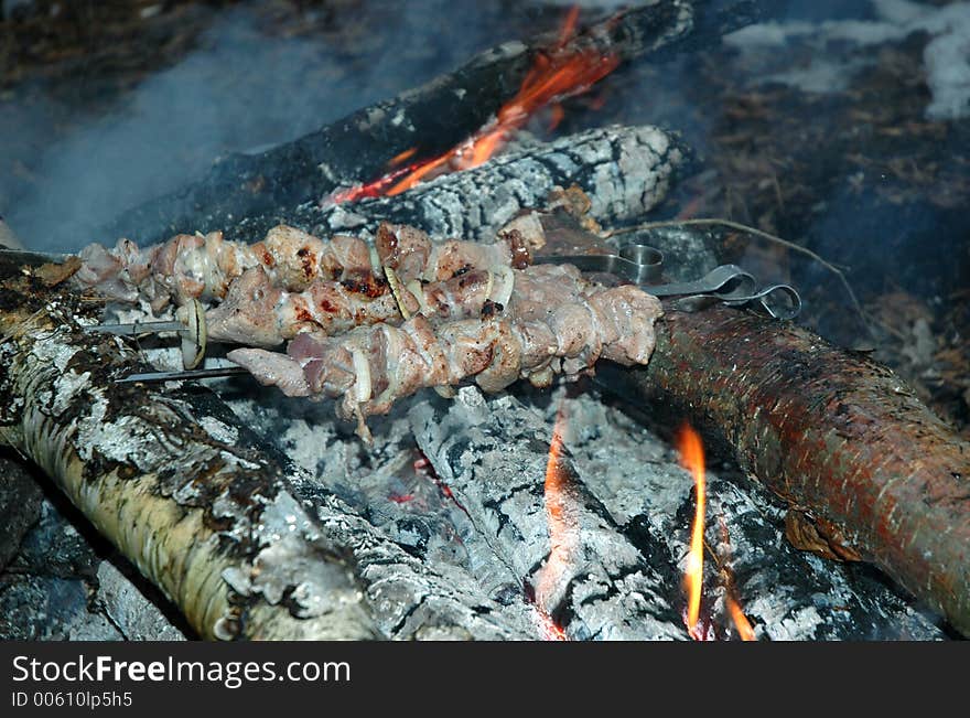 Grilled pork on bonfire