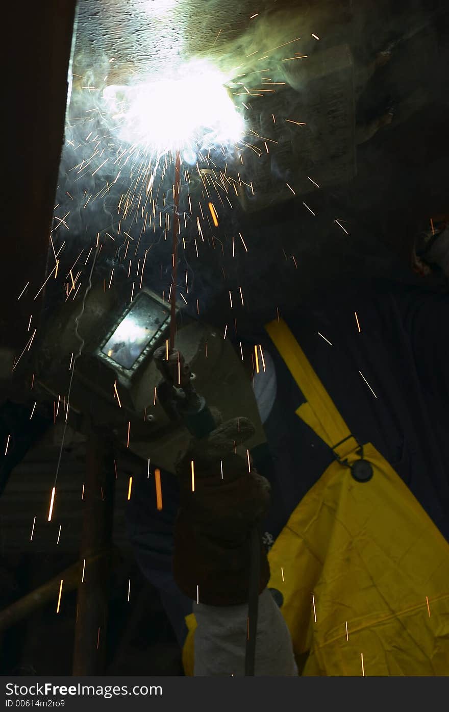 Close front view of welder at work. Close front view of welder at work