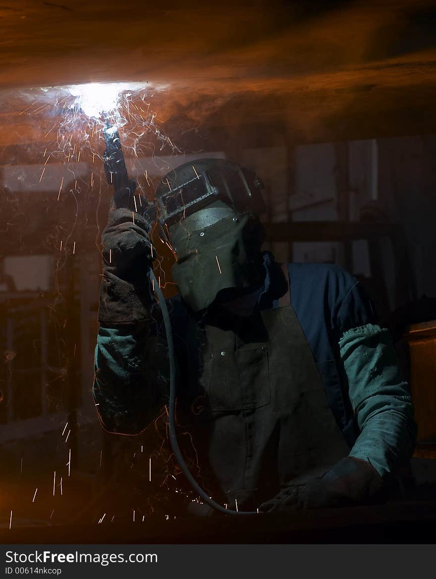 Welder under ship working. Welder under ship working