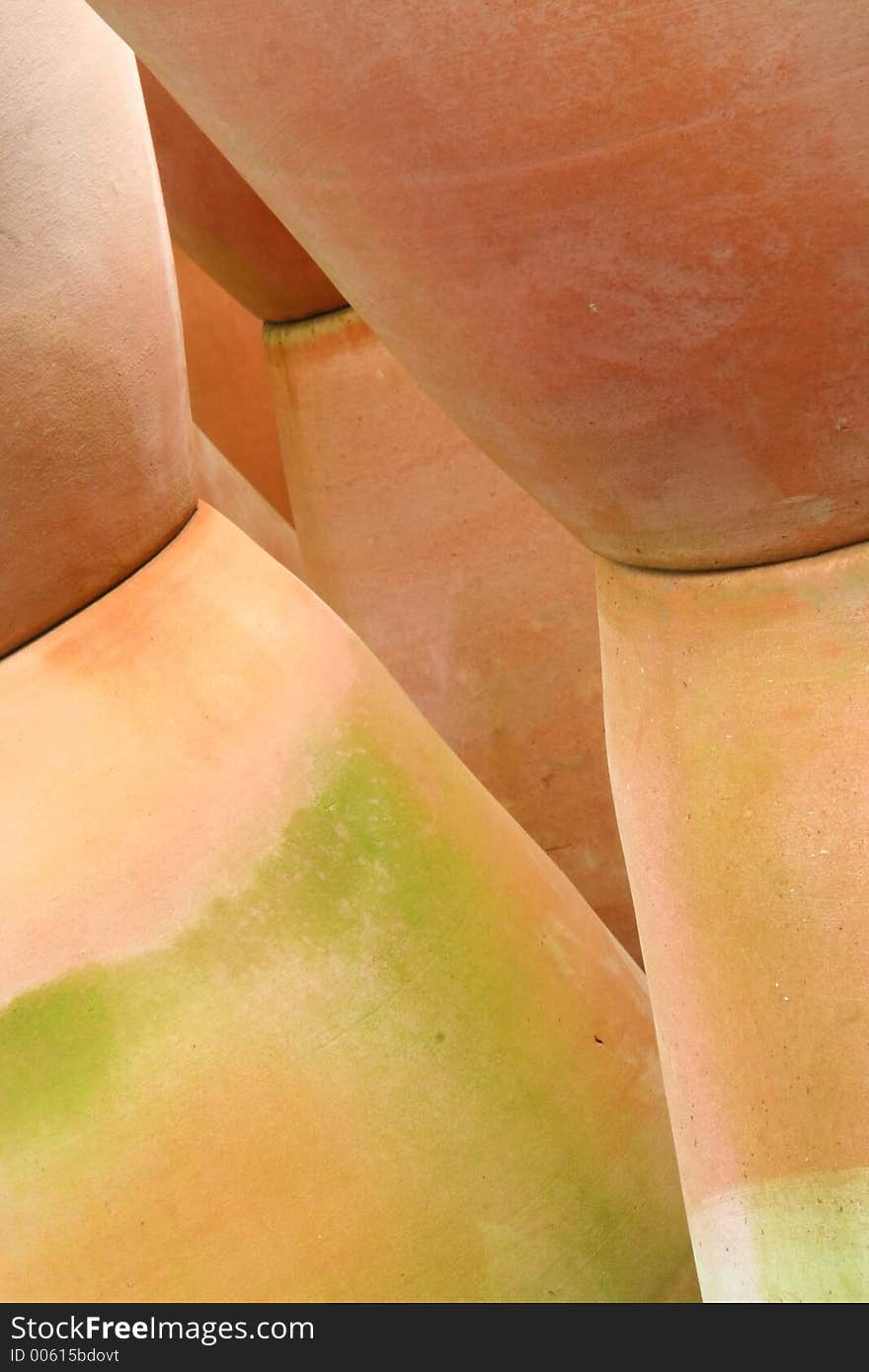 Stacked Terra Cotta Pots Create an Abstract Design. Stacked Terra Cotta Pots Create an Abstract Design.