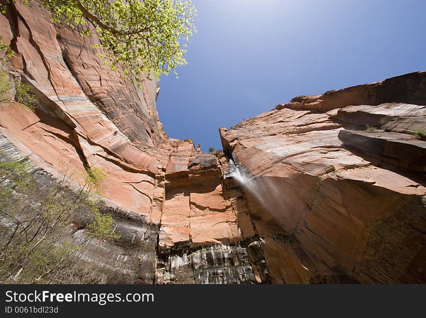 Upper emerald pool fall, Zion National Park, Utah, USA. Shot with a wide angle streight upto the rim. Upper emerald pool fall, Zion National Park, Utah, USA. Shot with a wide angle streight upto the rim.