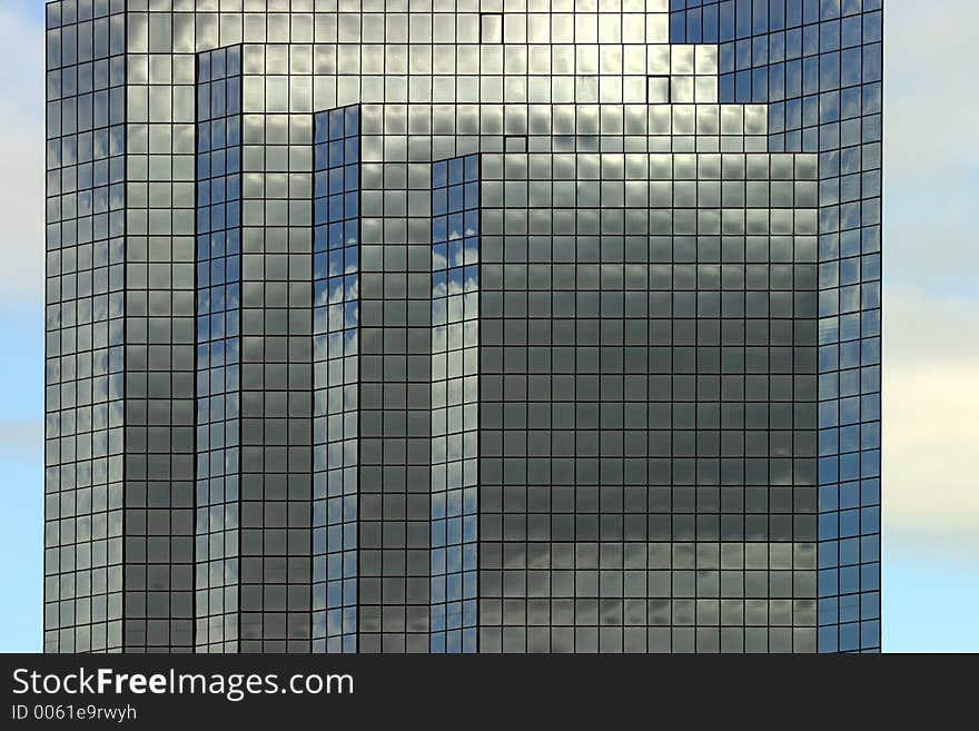 Modern office building in Bellevue, Wa. Blue reflective windows are startling. Modern office building in Bellevue, Wa. Blue reflective windows are startling.