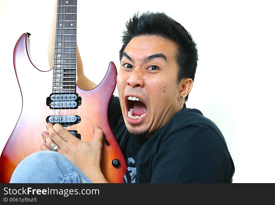 Close-up young man with guitar. Close-up young man with guitar.