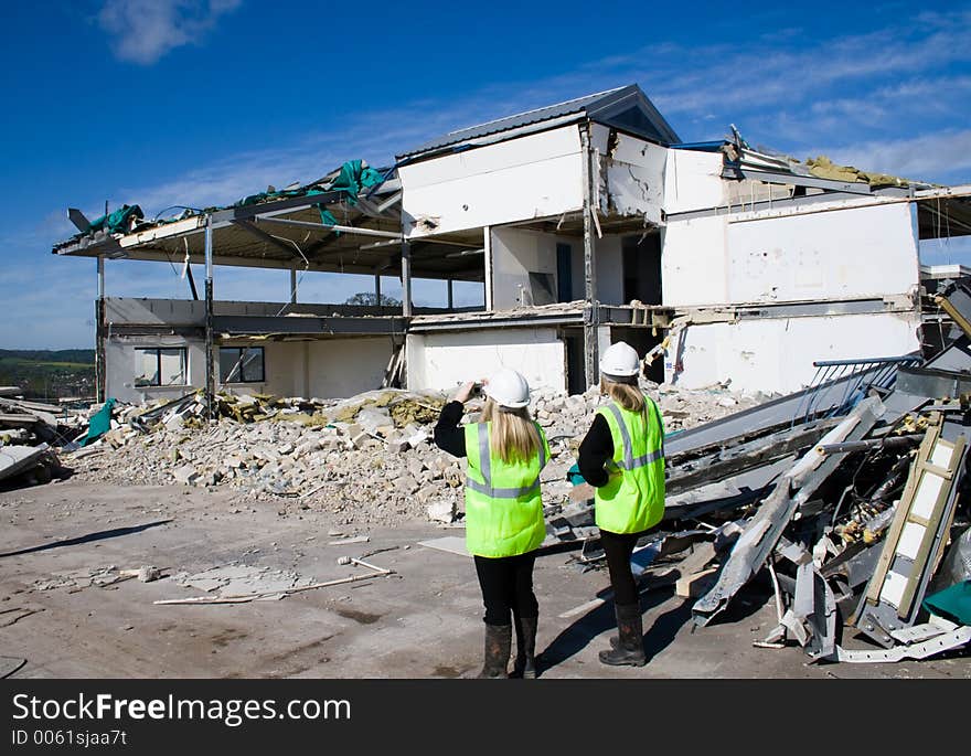 Women and Demolished Building