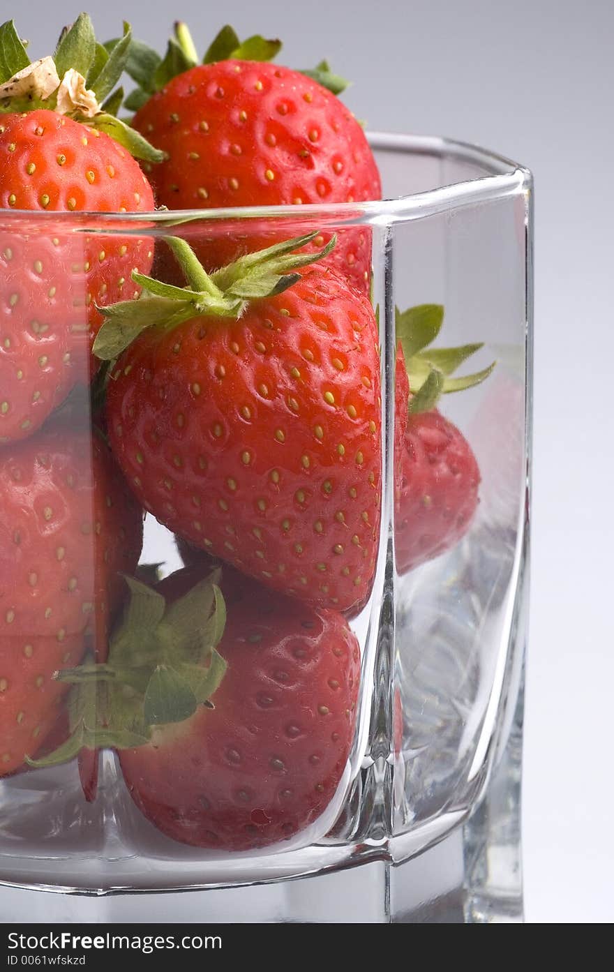 Strawberries in a glass tumbler. Strawberries in a glass tumbler