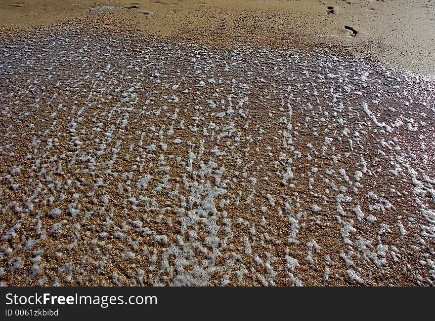 Footprints on wet sand. Footprints on wet sand