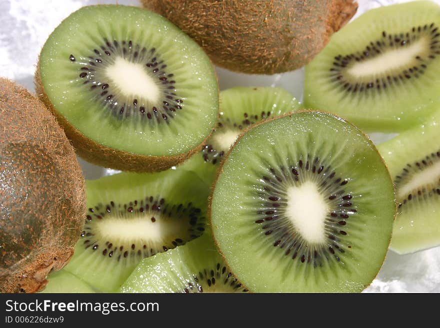 Delicious ripe kiwi fruit sliced open. Delicious ripe kiwi fruit sliced open.