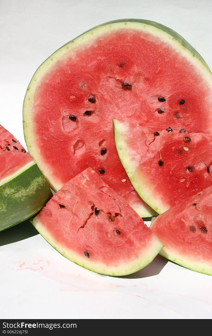 Slices of juicy watermelon on a white background. Slices of juicy watermelon on a white background.