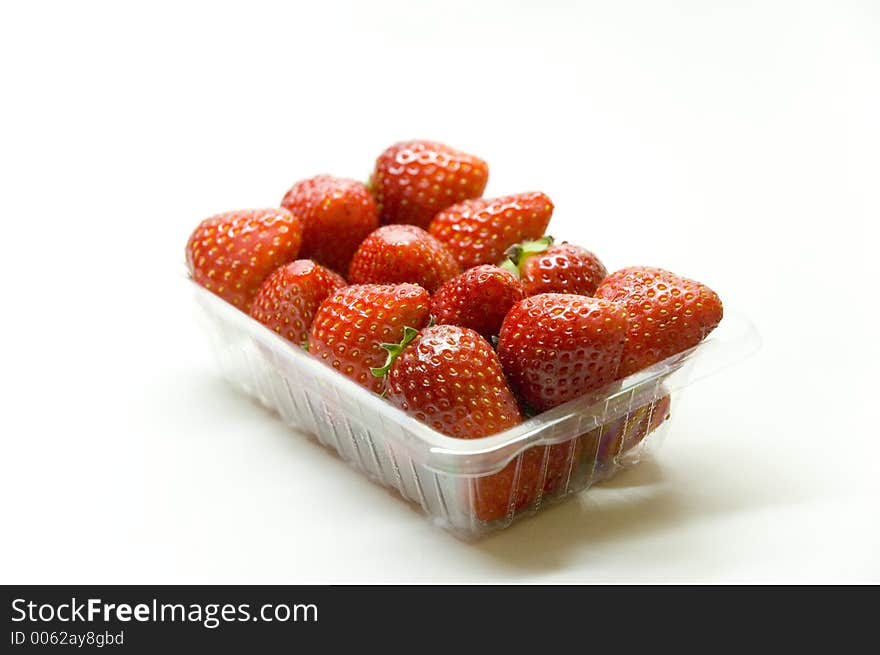 Close up shot of a bucket of strawberries
