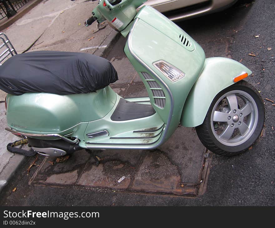 Green moped vespa