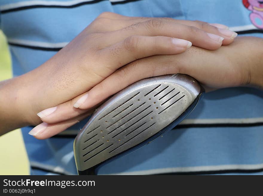 Hands of female golfer