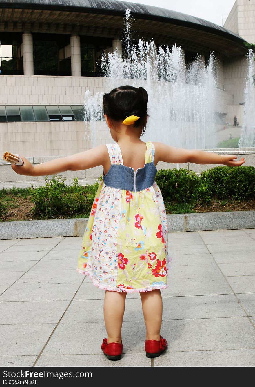 Young girl with her arms out