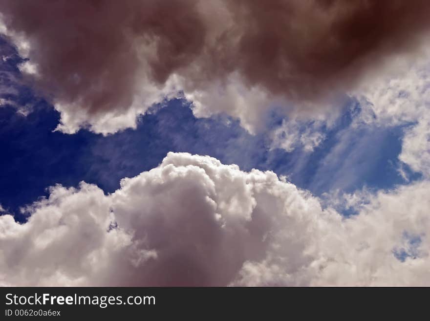 A break in the clouds revealing a blue ribbon of sky. A break in the clouds revealing a blue ribbon of sky.