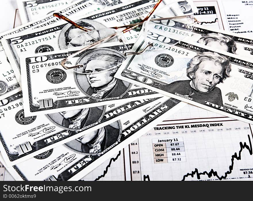 US currencies,spectacles and chart. US currencies,spectacles and chart