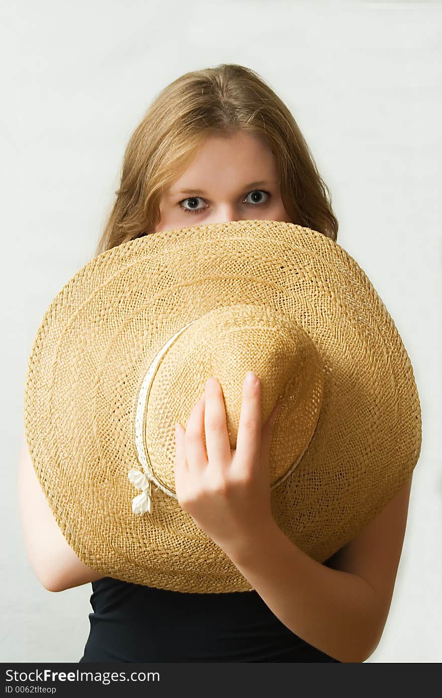 The girl hidden behind a hat