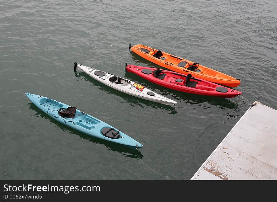 Colorful kayaks floating in the ocean