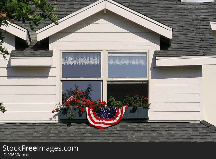 A house window box on Coronado Island decorated for the 4th of July holiday. A house window box on Coronado Island decorated for the 4th of July holiday.