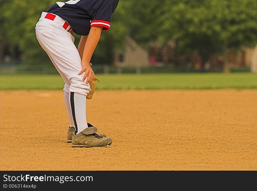 Infielder ready to react to next play. Infielder ready to react to next play.