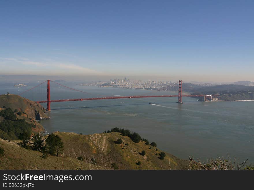 Panoramic view of the Golden Gate Bridge with Bay Bridge in the background. Panoramic view of the Golden Gate Bridge with Bay Bridge in the background.