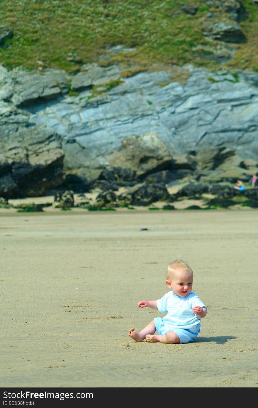 Small child exploring a beach in Cornwall. Small child exploring a beach in Cornwall.