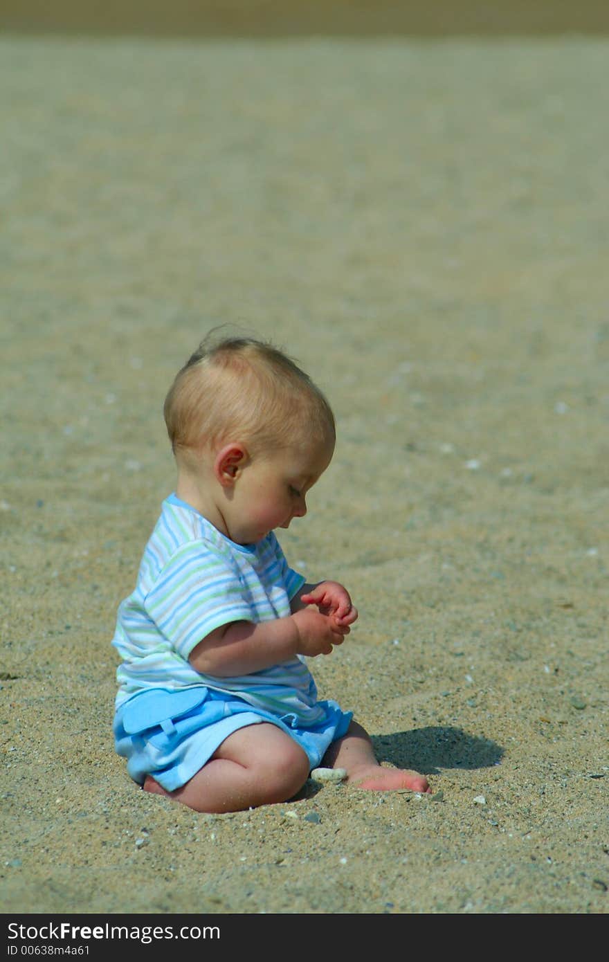 Small child exploring a beach in Cornwall. Small child exploring a beach in Cornwall.