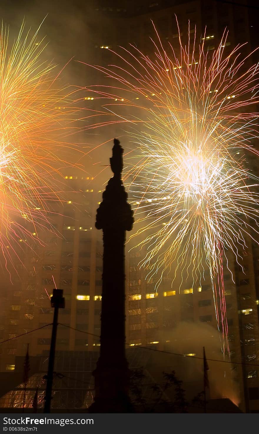 A downtown fireworks display performed in a downtown setting against a skyscraper