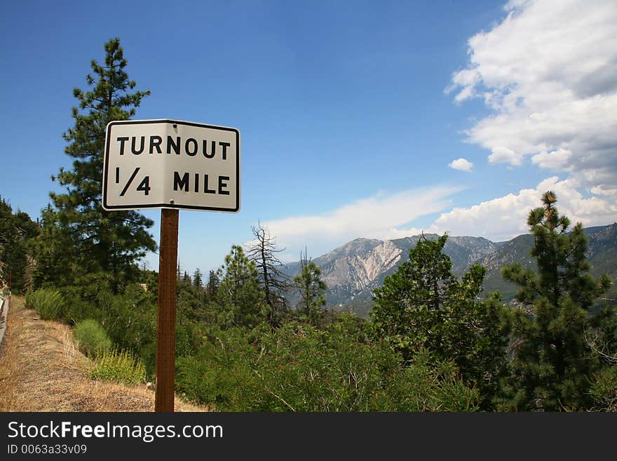 Turnout Sign Alongside Mountainside. Turnout Sign Alongside Mountainside