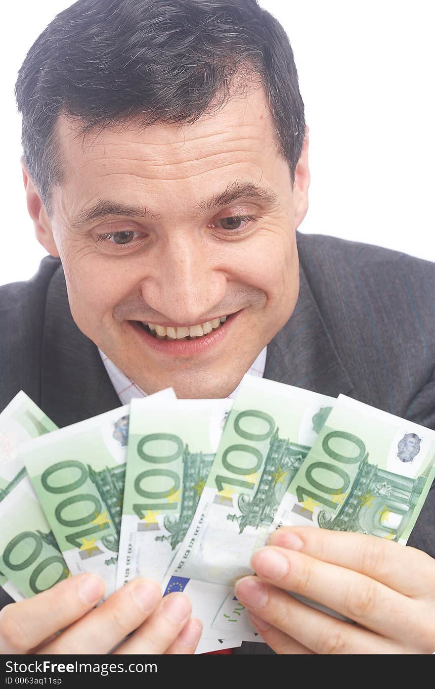 Businessman is happy about a handful of money