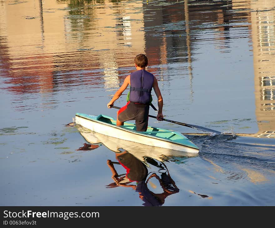 Young boy in blue kayak. Young boy in blue kayak