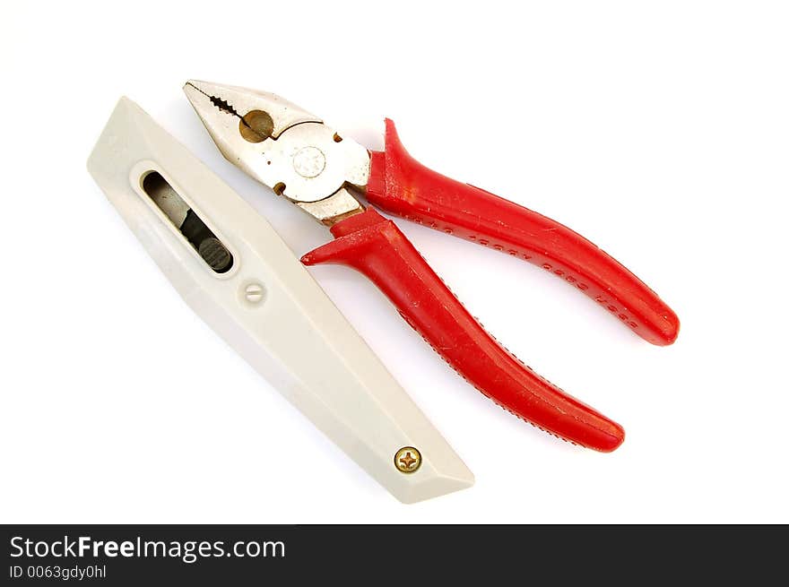 Tools kit - pilers and knife on white background. Tools kit - pilers and knife on white background