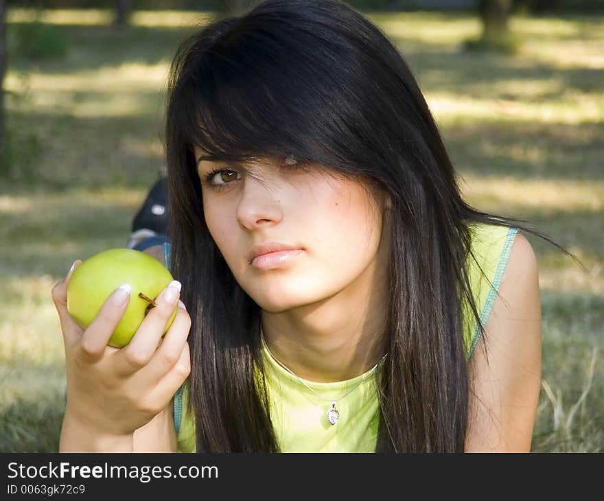 Beautiful girl with apple