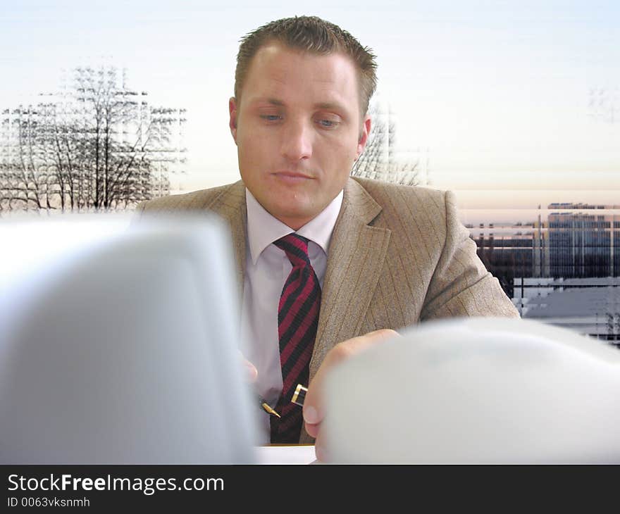 Man with pen at his desk is thinking of what he's going to write and how. Man with pen at his desk is thinking of what he's going to write and how.