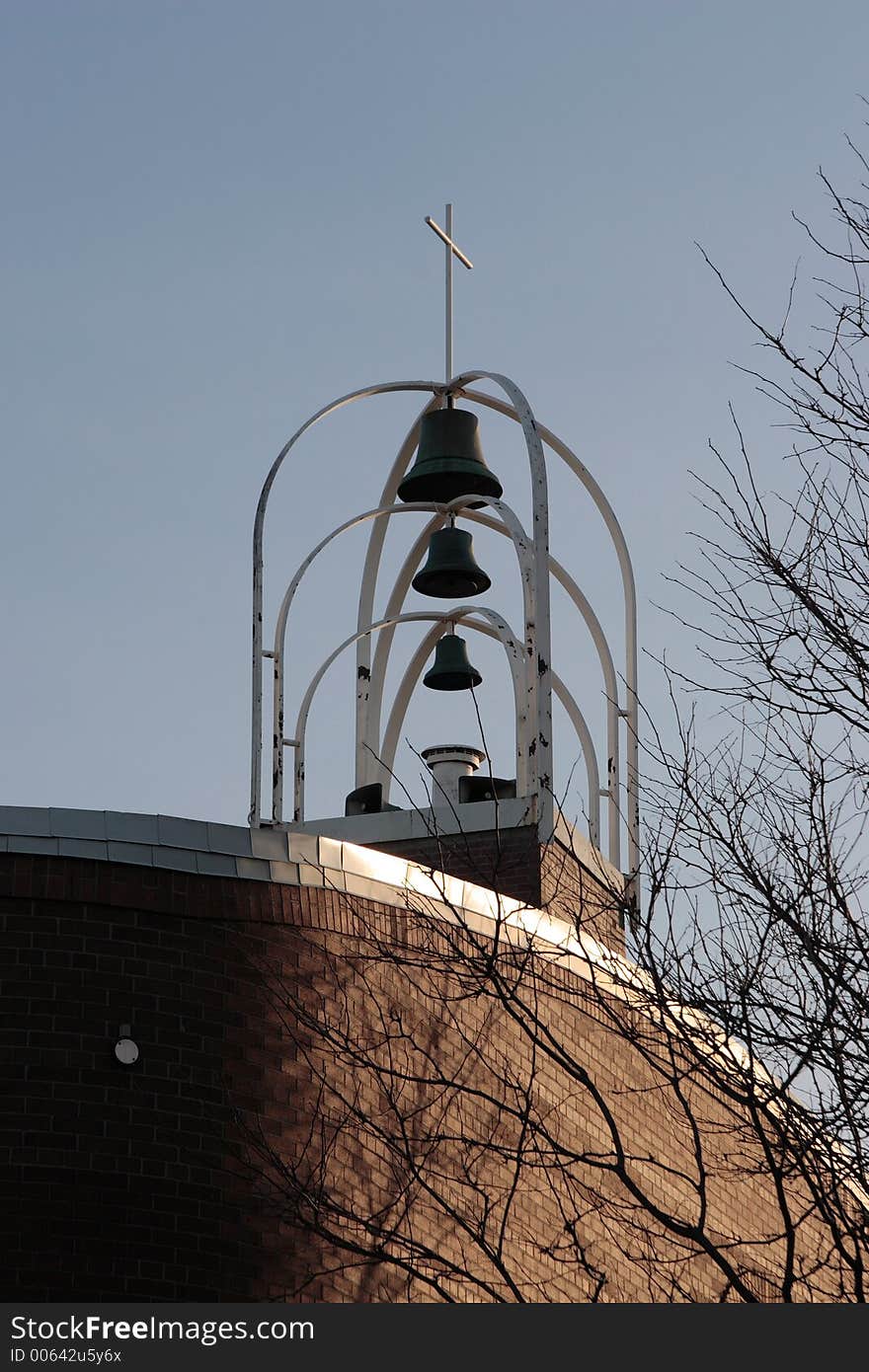 Modern church bells, cross and sky