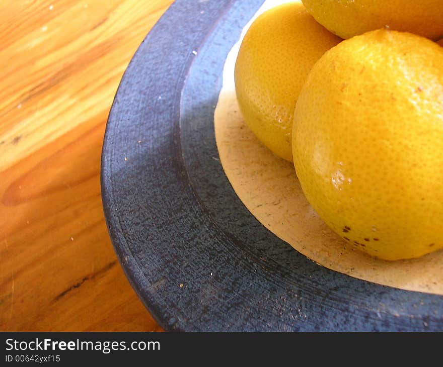 Lemons in a blue basket. Lemons in a blue basket