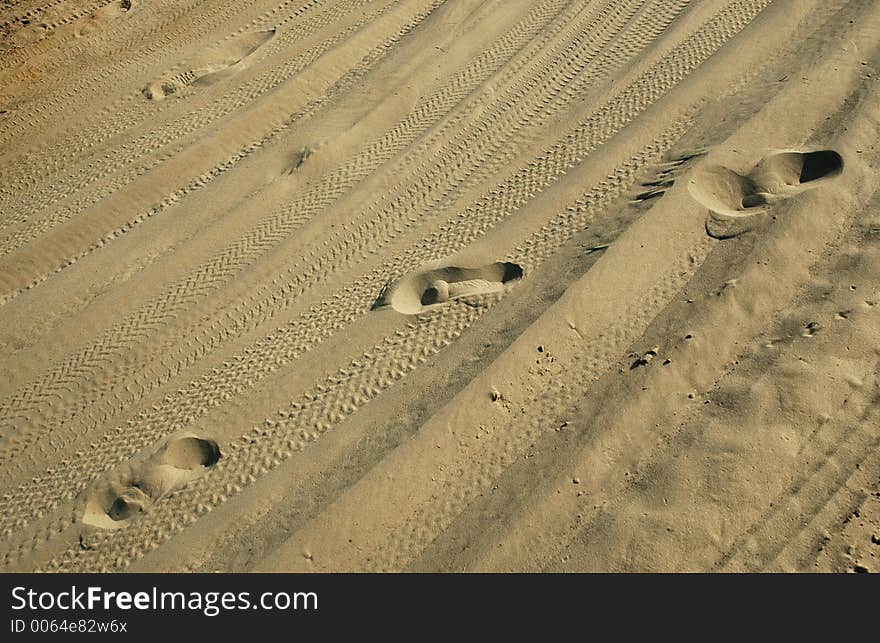 Girl track on sandy road